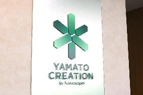 Yamato Creation signage and logo